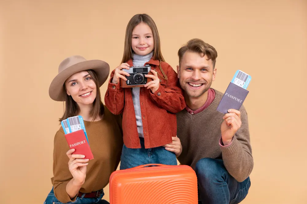 happy young couple tourists man woman holding air tickets suitcase light